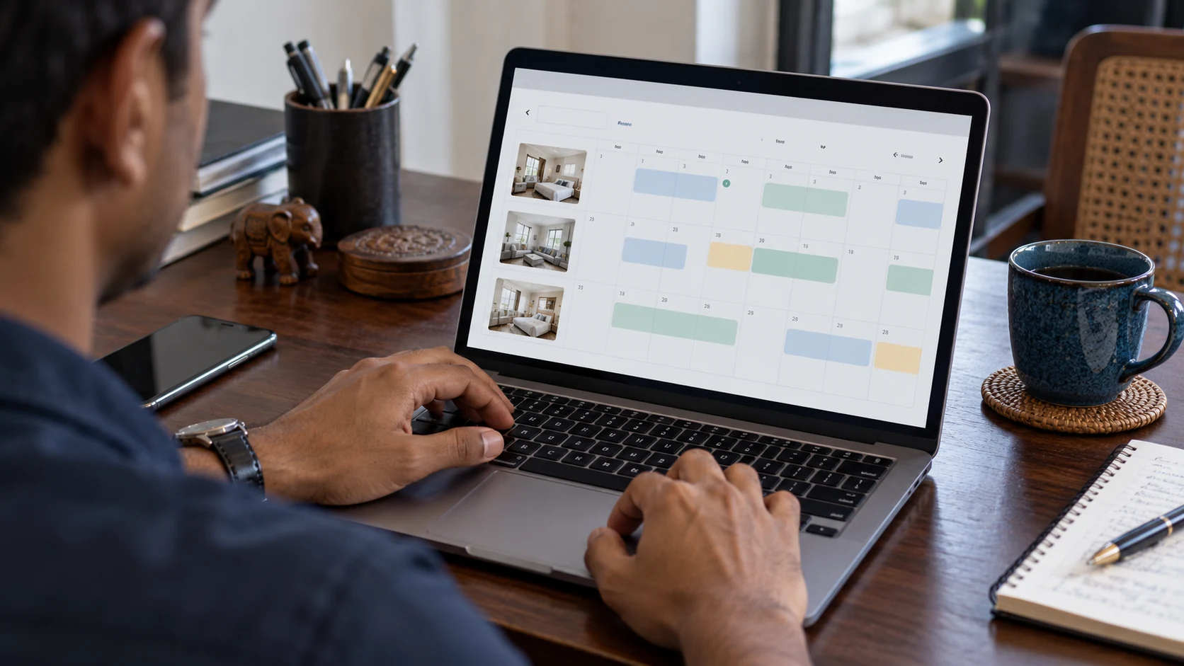 An owner following apartment bookings on a laptop